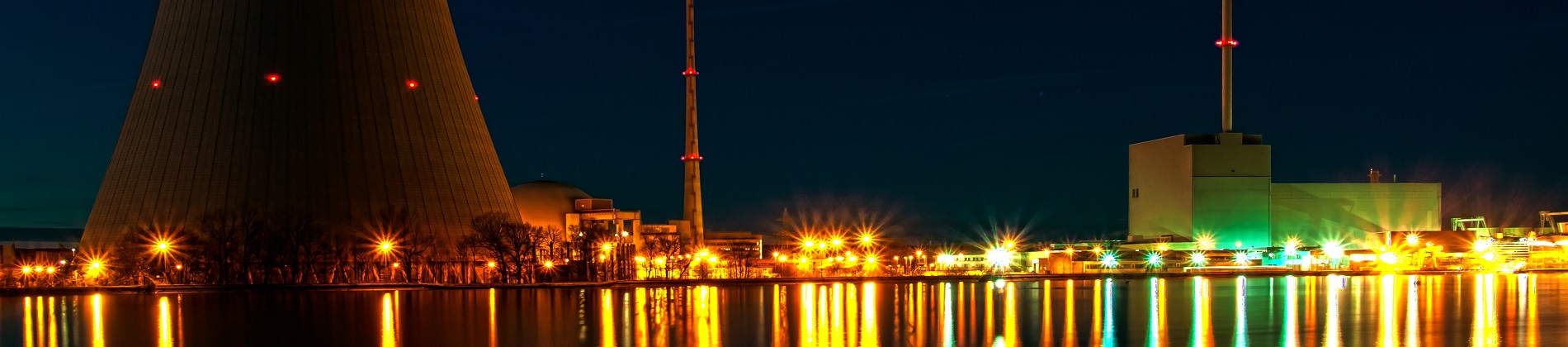 Landscape photograph of nuclear cooling tower at night